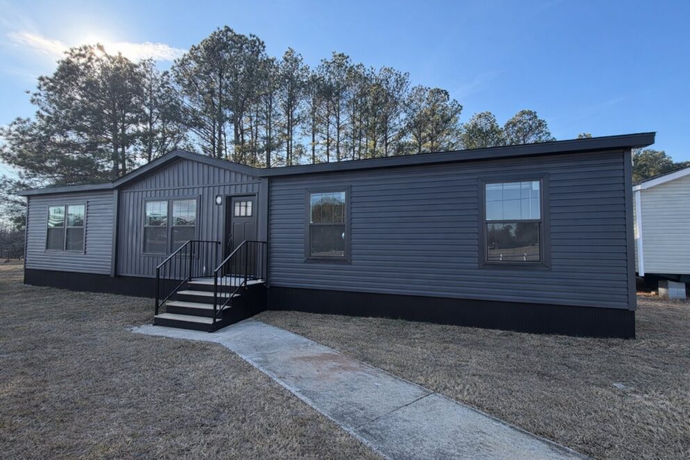 Full view of home with dormer